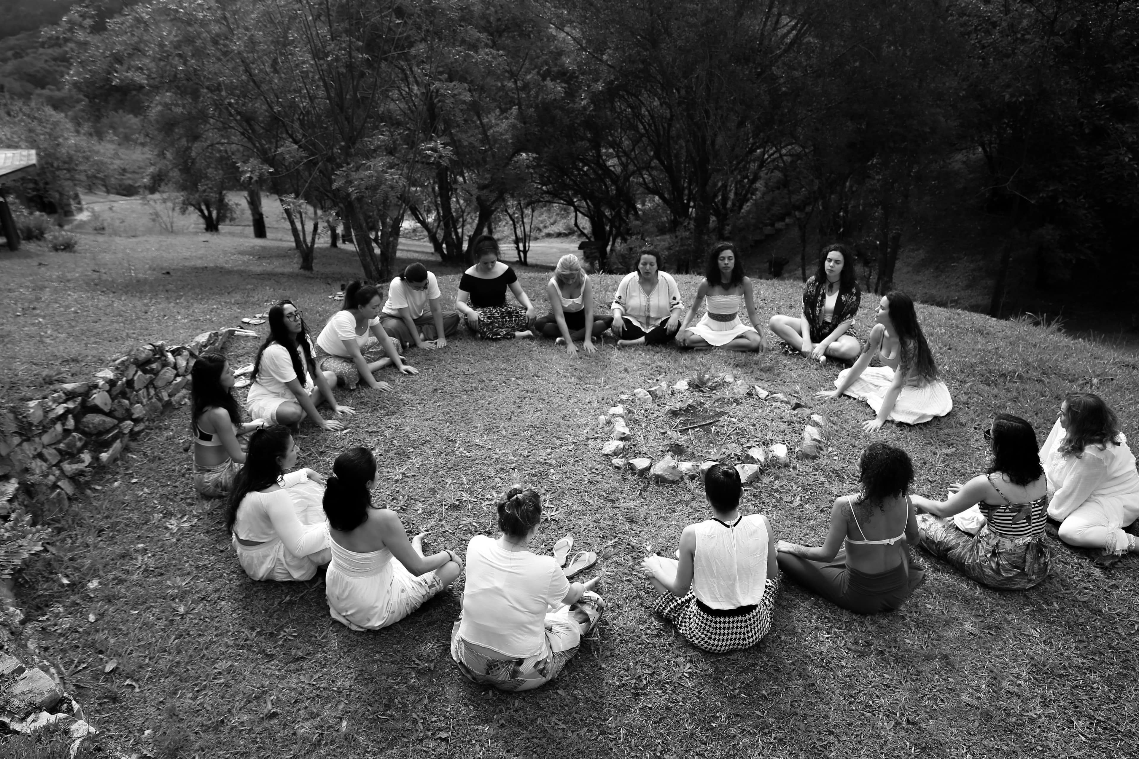 A circle of women gathered together outdoors — the spirit of La Loba Circle